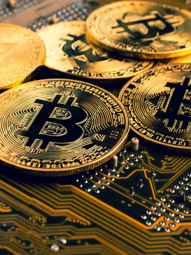 golden-coins-with-bitcoin-symbol-on-a-mainboard-